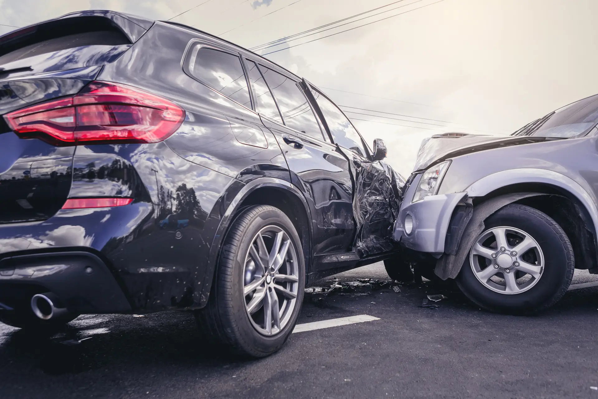 Two vehicles involved in a side-impact collision with visible body damage